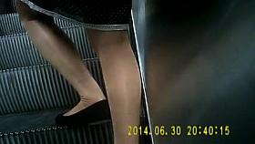 Nice shiny tan pantyhose girl on escalators