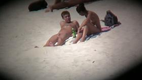 Beach cam shots of nude girls enjoying sand and sun