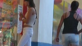 Sexy tanned babe in white captured by a hidden street cam