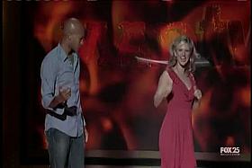 Live TV show with a black dude and a blonde with jiggling tits