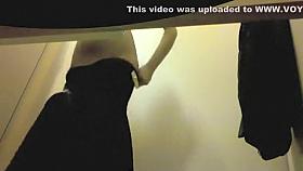 Sexy girl tries skirts in a fitting room
