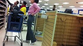 Teenage chick bends down to try shoes