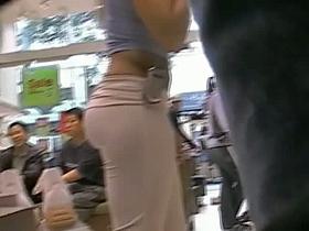 Beautiful ass, tight pink pants, pussy outline in a store candid
