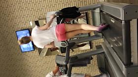 Hot blond girl on threadmill running with thong