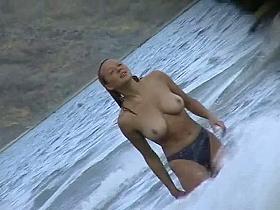 Curvy babes filmed on a nude beach
