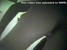 Hidden cam films a gal from below while she puts on a bikin
