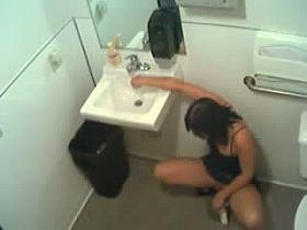 Toilet voyeur with brunette