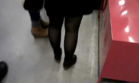 A few seconds with black pantyhosed legs.