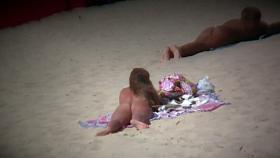 Aluring beach video of nudists enjoying the warm sun