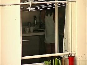 Voyeur films his hot neighbor in her kitchen