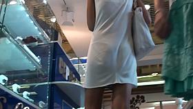 Upskirt street cam video of two hot babes in summer dresses