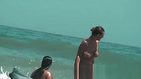 Sexy beach nudist girls get their hot booties admired