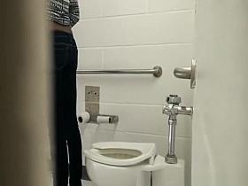 Ebony girl spied in public toilet peeing
