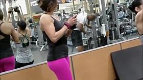 Strong woman voyeured in the gym