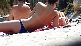 Beach voyeur 05 - Admirable topless cutie reads a book