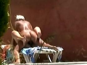 Horny couple fuck is spied by the pool