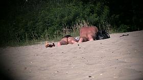 Hot couple of beach nudists voyeured on spycam from behind