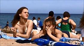Young topless teens on Barcelona spanish beach