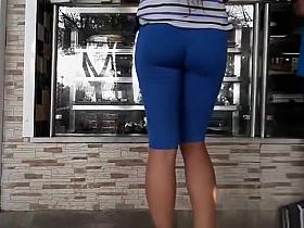 Long hair latin chick in blue spandex shorts