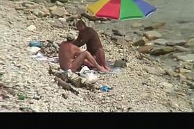 Nudist man fucking nude woman in beach