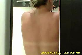 Dressing room hidden cam - Blonde topless from behind
