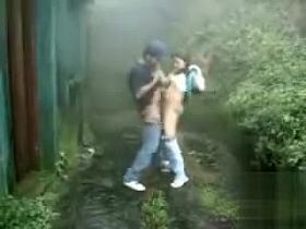 Couple fucks outdoors on a stormy day