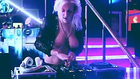 Nude DJ playing music with her tits bouncing