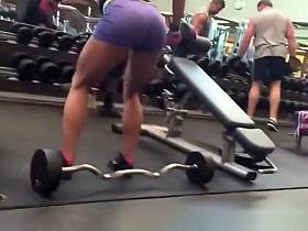 Woman in tight sports shorts exercising