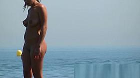 Slender cutie poses for a nudist beach voyeur