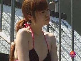 Hot redhead Asian babe got bikini sharked while sunbathing