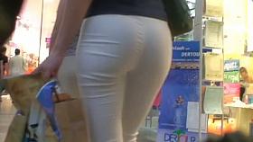 Hot tight and white pants girl in a supermarket voyeur video