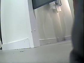 Legs in flat shoes on the fitting room voyeur camera