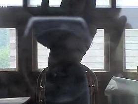Woman filmed through window dressing