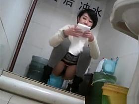Short hair asian peeing in public toilet