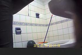 Long hair brunette woman spied in public toilet