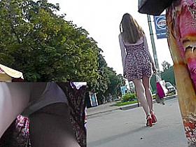Long-legged girls gets upskirted on the bus stop