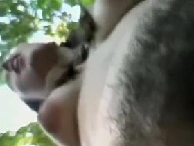 Hippie girl shows off hairy cunt in the woods