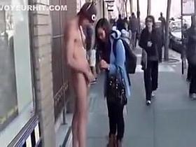 Naked man on the street amazes Asian woman