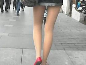 Upskirt pretty brunette in town, wearing pantyhose and laced undies
