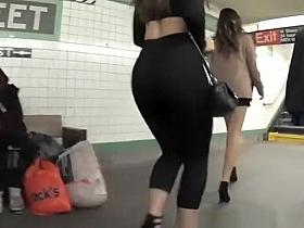 Hot chick wearing black leggings and high heels