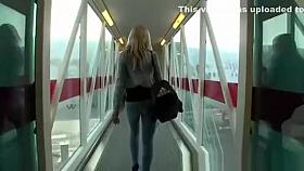 Hot blonde in tight jeans pants seat in airplane