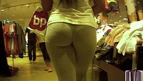 Candid sexy woman in gray tight leggings