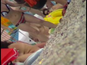 Hidden cam on a nudist beach shows men and women