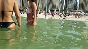 Long-haired Latina babe has fun at the beach with her mom