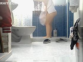 Chick with thick thighs and small tits spied in bathroom