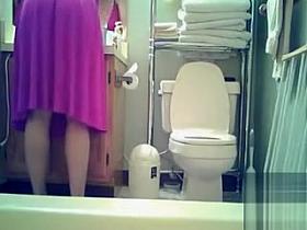 My sister in pink dress goes pee
