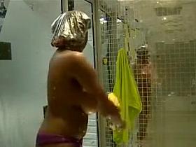 Black amateur with big breasts in voyeur shower scene