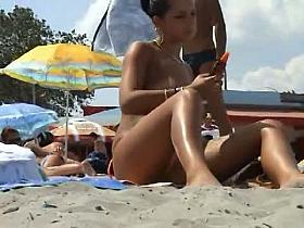 Sexy beach nudist women putting on lotion caught by spy cam