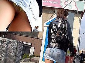 Upskirt of beauty in leather jacket