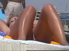Busty nudist beach caught on a hidden cam